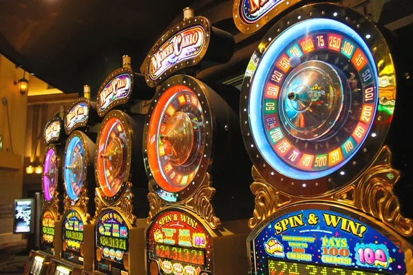 Bikini Paradise slot game interface on joker123 slot showing five reels, paylines, and stake controls